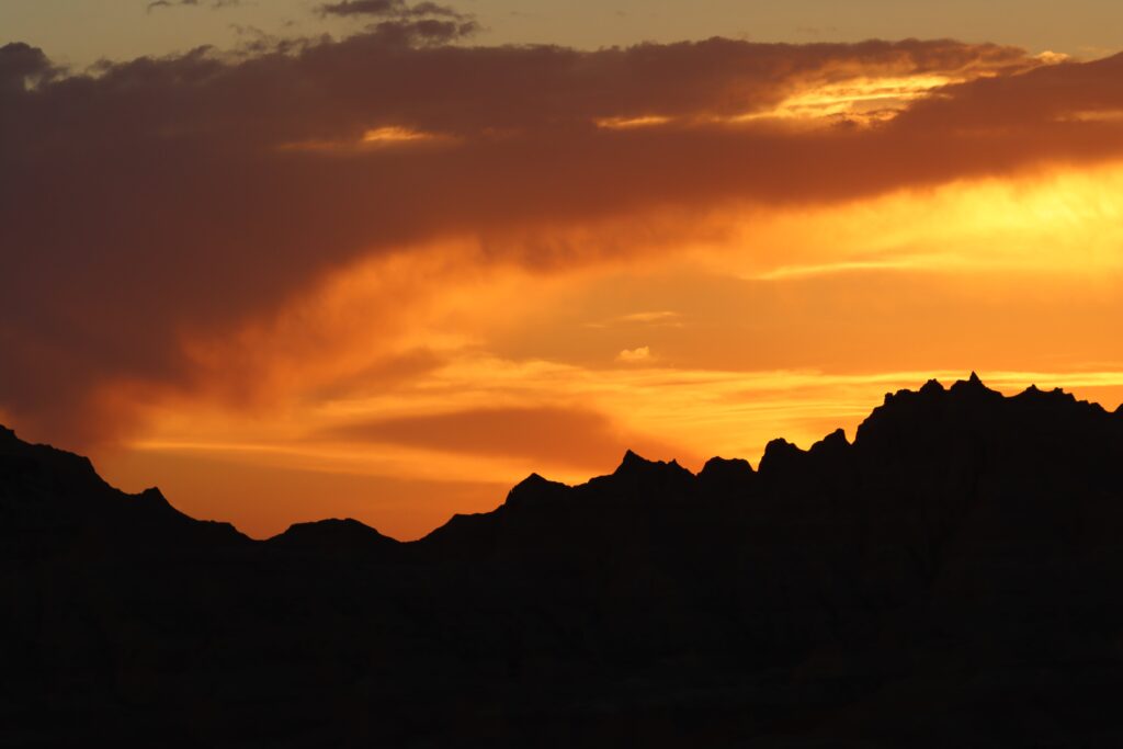 Badlands sunset with clouds and orange
