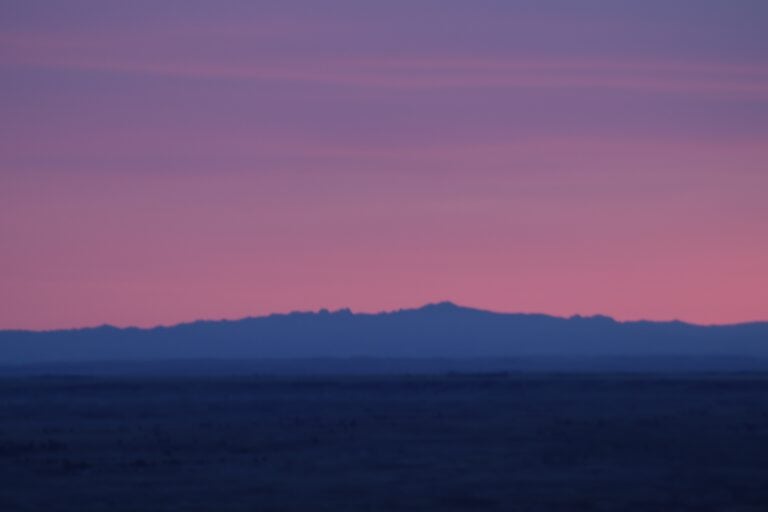 BADLANDS SUNSET AND GOLDEN HOUR TOUR | BADLANDS TOUR COMPANY 9 Blue hour in the badlands looking at the black hills at over 63 miles in the distance.